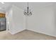Open dining area with a modern chandelier, adjacent to the kitchen, great for Gathering gatherings at 113 Dowington Ln, Cary, NC 27519