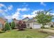 Beautiful single-story home with lush landscaping, a two-car garage, and a well-maintained lawn at 113 Dowington Ln, Cary, NC 27519