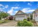 Well-maintained single-story home with a manicured lawn and a spacious two-car garage at 113 Dowington Ln, Cary, NC 27519