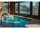 Indoor hot tub with tile and view of community pool at 113 Dowington Ln, Cary, NC 27519