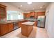 Modern kitchen with stainless steel appliances and a granite-topped island, perfect for cooking at 113 Dowington Ln, Cary, NC 27519