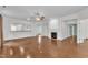 Open living space featuring hardwood flooring, fireplace, and seamless transition to adjacent rooms at 113 Dowington Ln, Cary, NC 27519