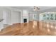 Spacious living room with hardwood floors, a fireplace, and seamless transitions to other areas at 113 Dowington Ln, Cary, NC 27519
