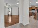 Open-concept living area with hardwood floors, connecting to the kitchen and other living spaces at 113 Dowington Ln, Cary, NC 27519