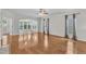 Sun-drenched living area with hardwood flooring and large windows, creating a bright and airy atmosphere at 113 Dowington Ln, Cary, NC 27519