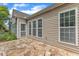 A beautifully tiled patio area with large windows, perfect for enjoying outdoor living at 113 Dowington Ln, Cary, NC 27519
