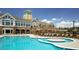 Resort-style pool with a sun deck, surrounded by lounge chairs and manicured landscaping at 113 Dowington Ln, Cary, NC 27519