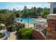 An inviting swimming pool with a hot tub, set within a beautifully landscaped community at 113 Dowington Ln, Cary, NC 27519
