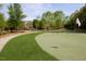 Putting green area with a clubhouse in the background at 113 Dowington Ln, Cary, NC 27519
