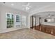 Bright sunroom featuring tiled floors, ample natural light, and seamless transitions to living areas at 113 Dowington Ln, Cary, NC 27519