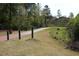 Walking trail lined with mature trees and landscaping at 113 Dowington Ln, Cary, NC 27519