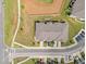 Birds eye view of neighborhood showcasing multiple townhomes with individual driveways and well maintained lawns at 1136 Longitude Dr, Durham, NC 27713