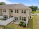 Cozy backyard with a small patio, fence, and landscaping for a relaxing outdoor space at 1136 Longitude Dr, Durham, NC 27713