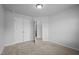 Empty bedroom featuring carpet, light walls, and closet at 1136 Longitude Dr, Durham, NC 27713
