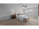 Bedroom with neutral walls, carpet, fan, and a large window at 1136 Longitude Dr, Durham, NC 27713