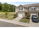 Charming townhome featuring a one car garage, complemented by lush landscaping and inviting curb appeal at 1136 Longitude Dr, Durham, NC 27713