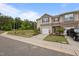 Inviting townhome featuring a one-car garage, neutral siding, well-maintained landscaping, and a welcoming facade at 1136 Longitude Dr, Durham, NC 27713