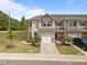 Charming townhome featuring a one-car garage, neutral siding, and manicured landscaping, creating a welcoming curb appeal at 1136 Longitude Dr, Durham, NC 27713