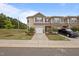 Charming townhome featuring a one-car garage, neutral siding, and well-maintained landscaping at 1136 Longitude Dr, Durham, NC 27713
