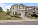Inviting townhome featuring a one car garage, neutral siding, well-maintained landscaping, and a charming facade at 1136 Longitude Dr, Durham, NC 27713