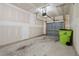 Spacious one car garage featuring concrete flooring, drywall, and an automatic garage door at 1136 Longitude Dr, Durham, NC 27713
