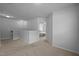 Upstairs hallway with neutral carpeting and views into a bedroom at 1136 Longitude Dr, Durham, NC 27713
