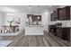 Open concept kitchen with stainless steel appliances, a center island, and adjacent dining area at 1136 Longitude Dr, Durham, NC 27713