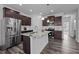 Kitchen features include hardwood floors, granite countertops, stainless appliances, and dark wood cabinets at 1136 Longitude Dr, Durham, NC 27713