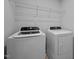 Laundry room with washer, dryer, and wire shelving at 1136 Longitude Dr, Durham, NC 27713