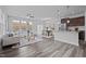 Open concept living room, dining room and kitchen with lots of light and modern furniture at 1136 Longitude Dr, Durham, NC 27713