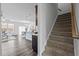 Open-concept layout with a kitchen island, dining area, living room, and staircase at 1136 Longitude Dr, Durham, NC 27713