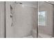 Modern shower with a glass door, tiled walls, and a built-in bench at 1136 Longitude Dr, Durham, NC 27713