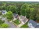 Charming suburban homes nestled amongst lush trees, featuring manicured lawns and inviting curb appeal at 12325 Amoretto Way, Raleigh, NC 27613