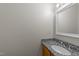 Bathroom features granite countertops, white ceramic sink, and a well-lit vanity mirror at 12325 Amoretto Way, Raleigh, NC 27613