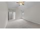 Comfortable bedroom with neutral carpeting and ample natural light at 12325 Amoretto Way, Raleigh, NC 27613