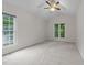 Inviting bedroom with neutral carpet, vaulted ceiling, and large windows at 12325 Amoretto Way, Raleigh, NC 27613