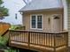 Back deck overlooking backyard; home has tan siding and a light-colored door at 12325 Amoretto Way, Raleigh, NC 27613