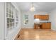 Dining area featuring wood floors, lots of natural light, and a granite countertop desk at 12325 Amoretto Way, Raleigh, NC 27613