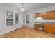 Bright dining area with hardwood floors, granite counter-tops, and ample natural light at 12325 Amoretto Way, Raleigh, NC 27613