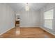Dining area with hardwood floors, chandelier, and trim details. View into the kitchen at 12325 Amoretto Way, Raleigh, NC 27613