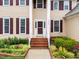 Front of home has brick steps with a tan colored exterior at 12325 Amoretto Way, Raleigh, NC 27613