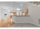Open kitchen featuring granite counters, wood cabinets, and hardwood floors at 12325 Amoretto Way, Raleigh, NC 27613