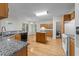 Well-equipped kitchen featuring granite countertops and a kitchen island at 12325 Amoretto Way, Raleigh, NC 27613
