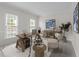 Bright office space with rustic wooden desk, chair, and built-in shelving at 12325 Amoretto Way, Raleigh, NC 27613