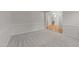 Open room with plush neutral carpeting leading to an open plan dining room at 12325 Amoretto Way, Raleigh, NC 27613