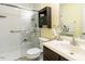 Clean bathroom with a walk-in shower, vanity, and well-lit mirror at 1290 Pyrtle Dr, Graham, NC 27253