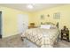 Inviting bedroom with a comfortable bed, ceiling fan, and ample storage space at 1290 Pyrtle Dr, Graham, NC 27253