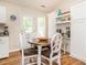 Cozy breakfast nook with white cabinets and a modern design at 1290 Pyrtle Dr, Graham, NC 27253