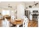 Cozy living room and kitchen area featuring hardwood floors and plenty of natural light at 1290 Pyrtle Dr, Graham, NC 27253