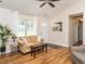Bright living room with modern decor, wood floors, and lots of natural light at 1290 Pyrtle Dr, Graham, NC 27253
